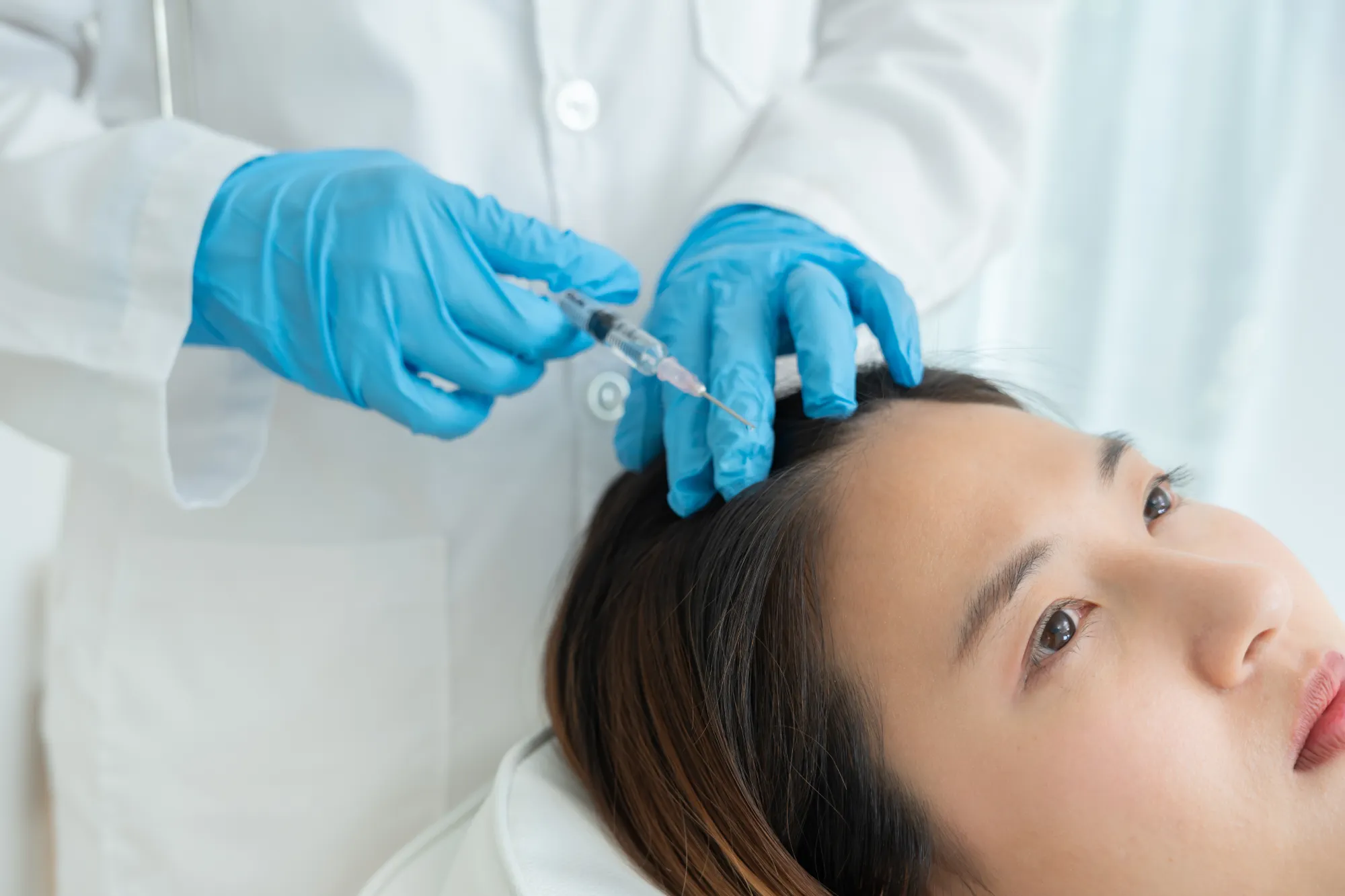 “Patient receiving hair restoration treatment at Gentle Giant Care LLC.”