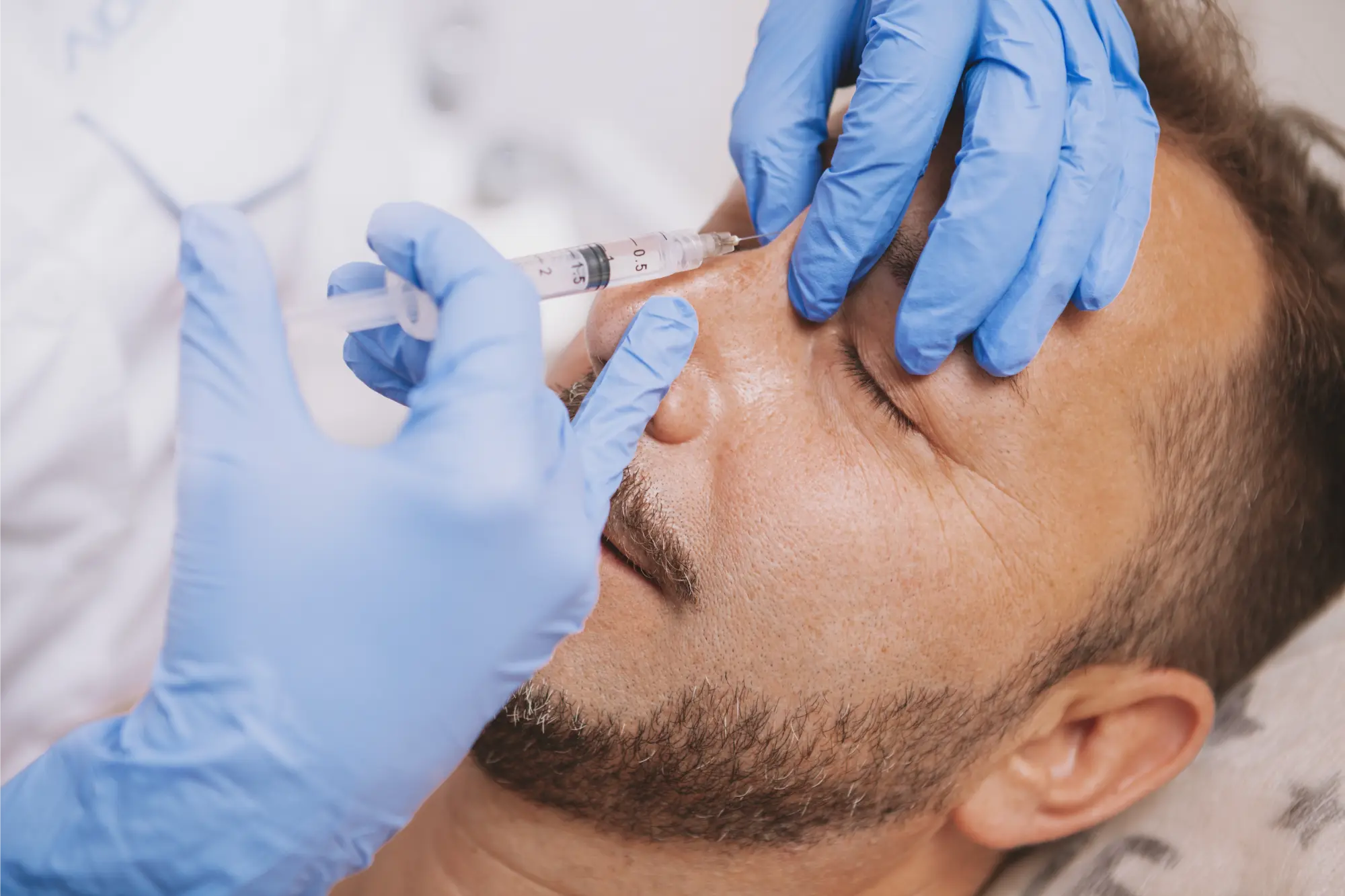 “Patient and clinician discussing nose shape during a liquid rhinoplasty consultation.”
